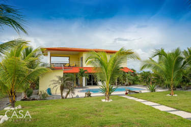 Covered terrace overlooking swimming pool and beach at beachfront villa Las Olas Playa Barqueta Panama