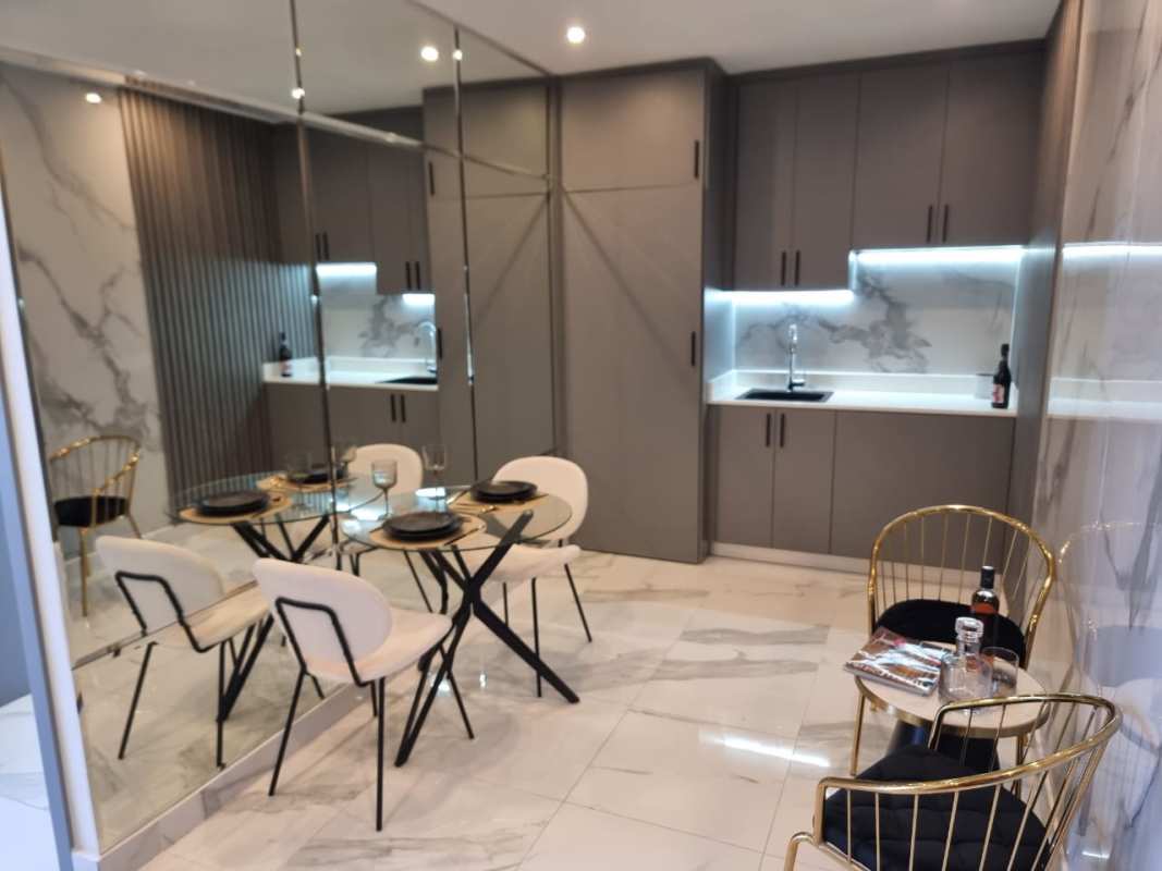 Integrated living dining kitchenette space in studio apartment PH The Walker Avenida Balboa Panama