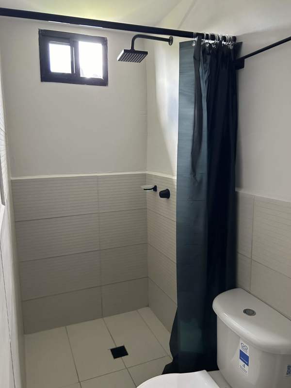 Laundry room featuring triple concrete sink, washer, dryer at Altos de San Ángel Tocumen Panama