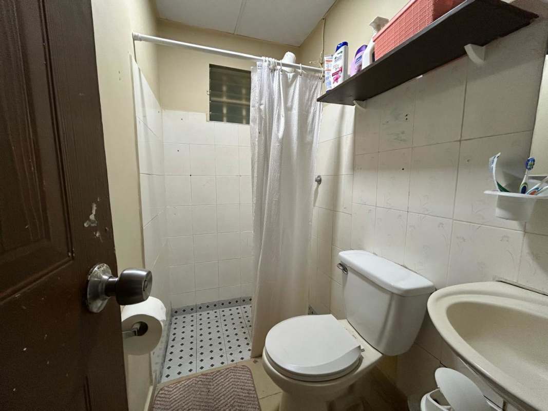 Kitchen with granite counters, white cabinets, stove hookup in Urbanizacion Casa Real Panama