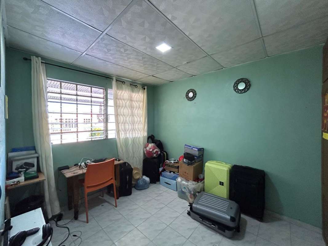 Functional bathroom with white tiles, shower curtain, and shelving Urbanizacion Casa Real Panama