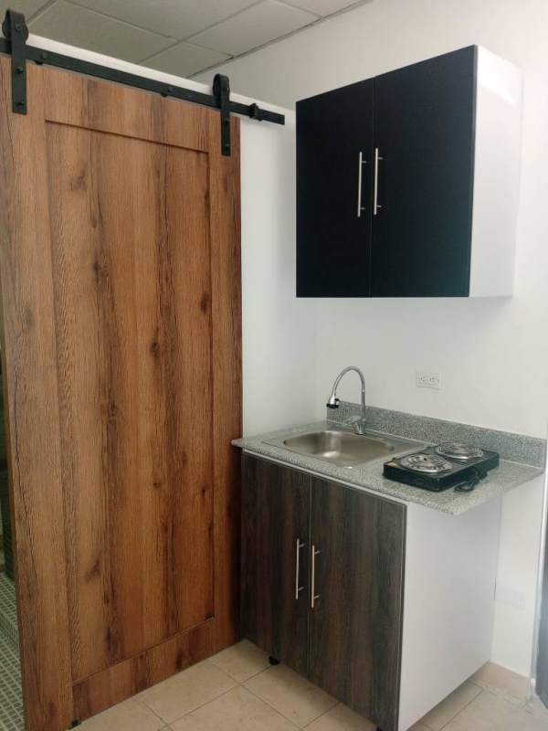 Bathroom with vessel sink, mosaic tile accents, rustic mirror Chanis studio Panama