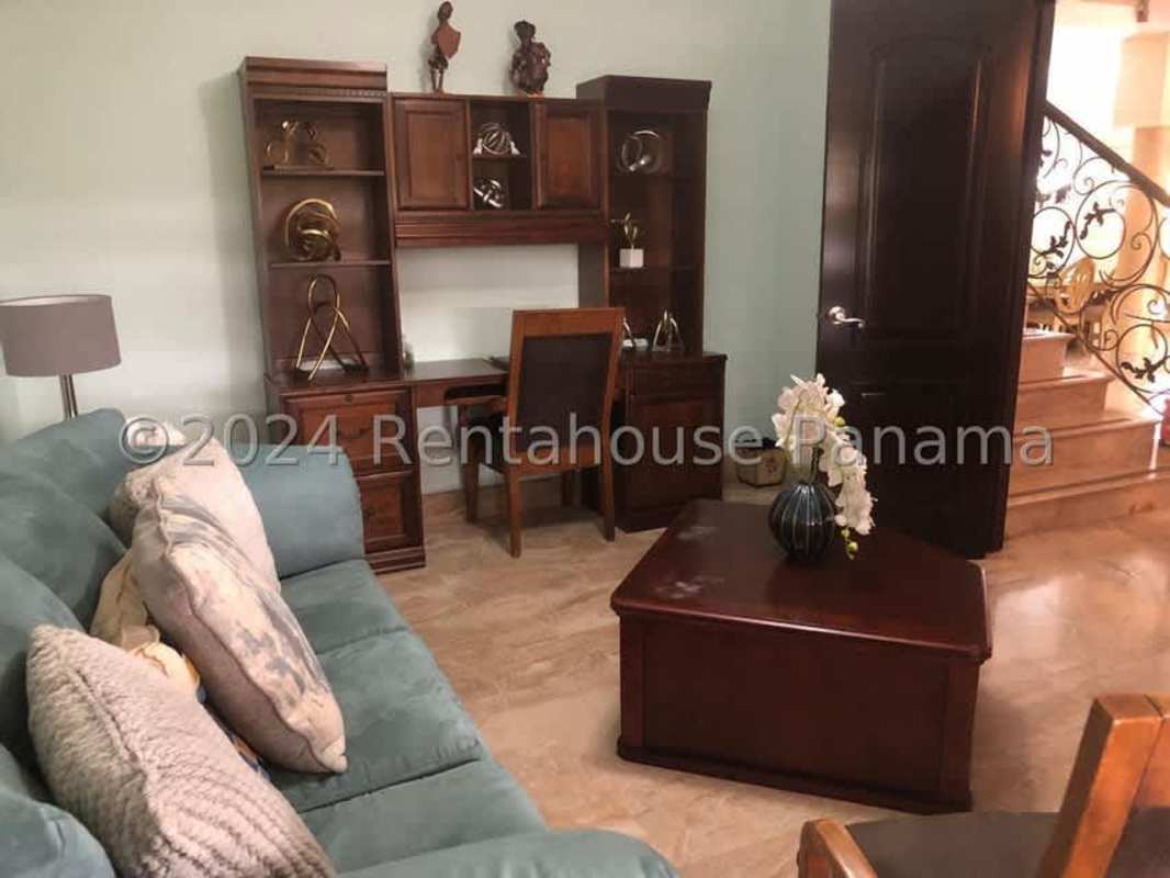 Formal dining area with chandelier and marble floors at Santa María country club home