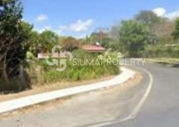 Roadside view with sidewalk and residential house near Penonomé investment land