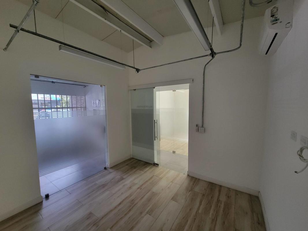 Interior office space tile floor glass partitions El Dorado Panama