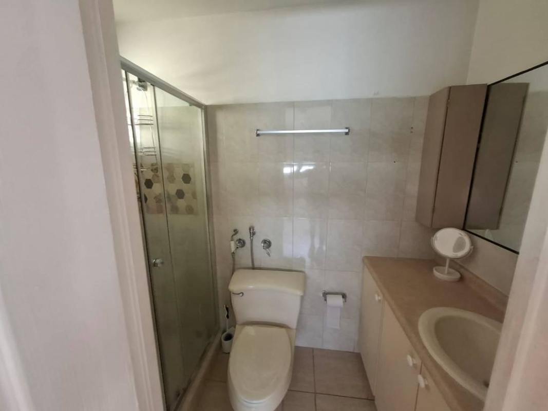 Open dining area near balcony doors in condo PH Parque de Versalles Panama City