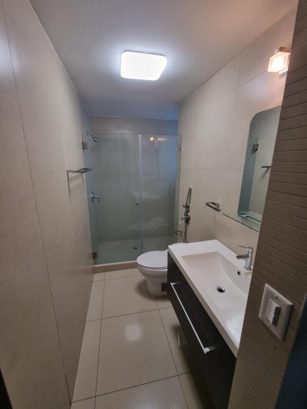 Bathroom with glass shower enclosure, modern fixtures in Top Tower Costa del Este