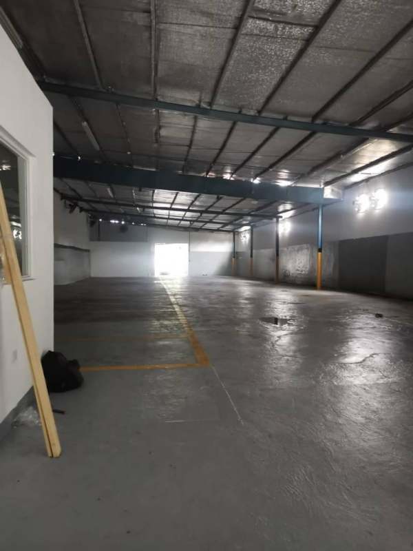 Empty warehouse with high ceiling lighting industrial beams Santa Elena Chanis Panama