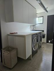 Two-car covered garage plus exterior parking at modern home in Nativa Panama Pacifico