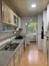 Traditional kitchen with granite counters, cabinetry, appliances Residencial Espinar Colón