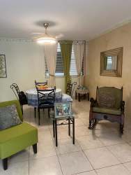 Galley style kitchen with appliances white cabinetry Residencial Espinar Colón