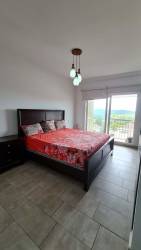 Contemporary bedroom with balcony, tile floors furnished rental in Tucán Country Club Panama City