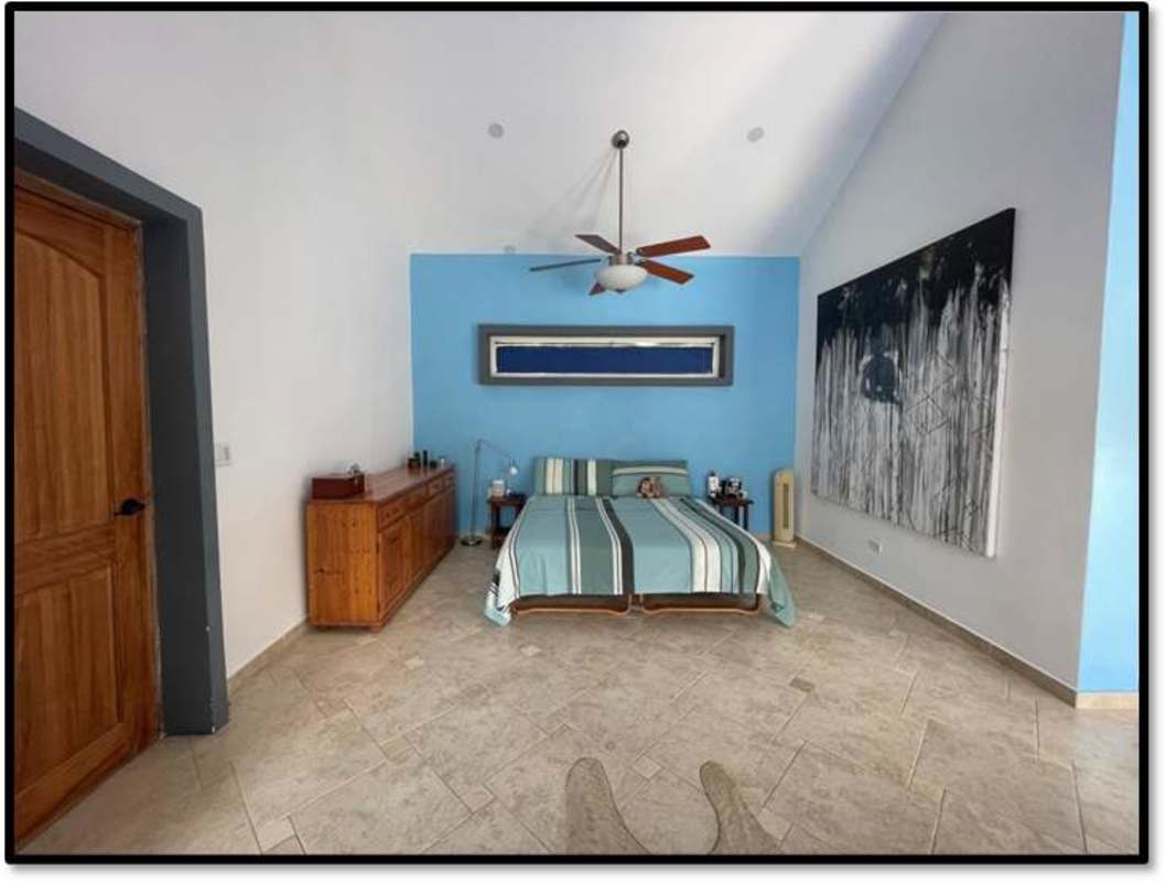 Functional outdoor laundry with granite counter and barbecue grill in Clayton residence Panama