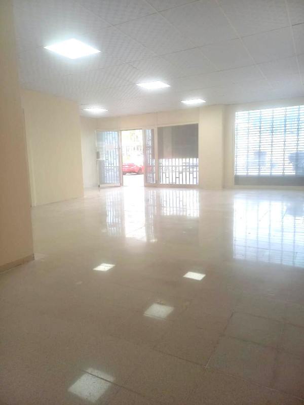 Street view of ground floor commercial space for lease on Via España with parking and signage options