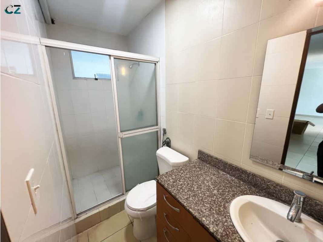 Closed kitchen with granite counters, upper cabinets and tile backsplash in PH Blue Park Bella Vista Panama City