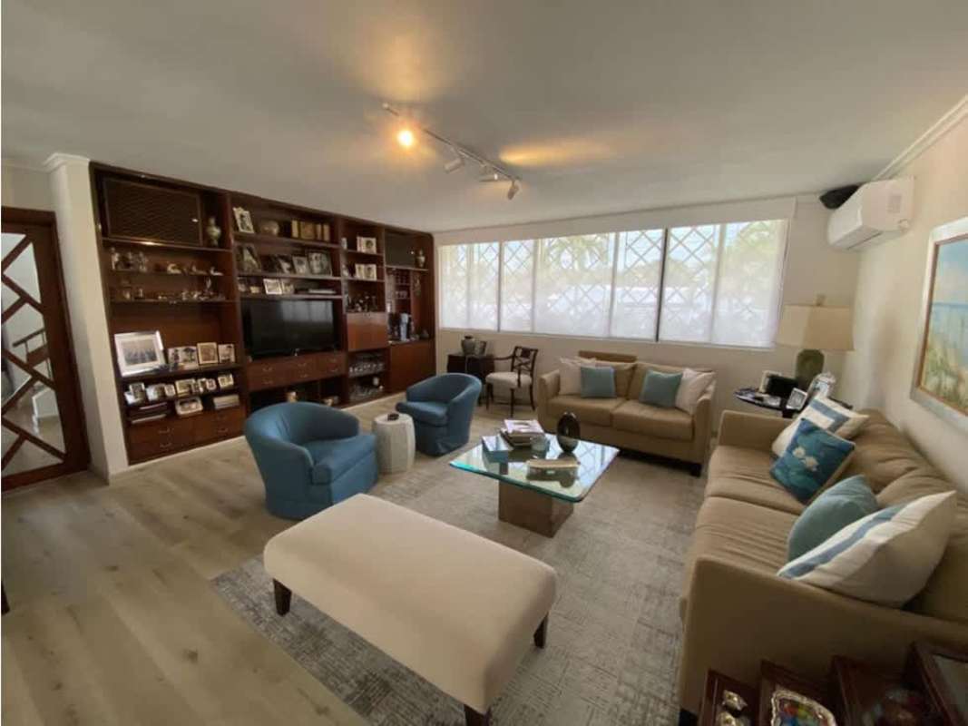 Contemporary living room with large windows built-in shelving and elegant decor in San Francisco Panama