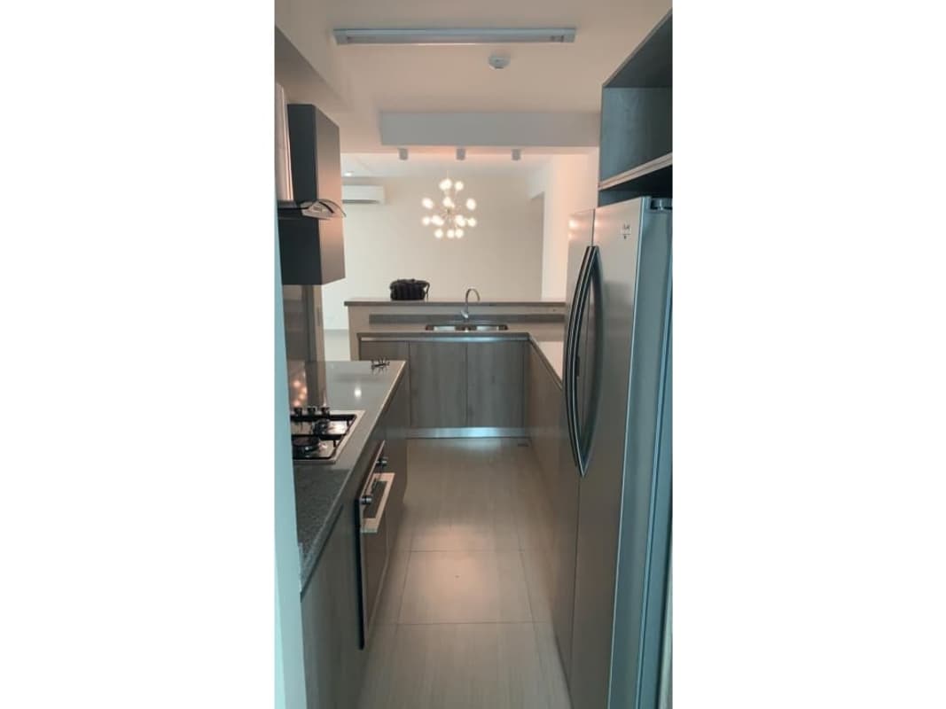 Empty bedroom with ceiling fan and grey blinds in PH Asia Costa del Este apartment Panama City