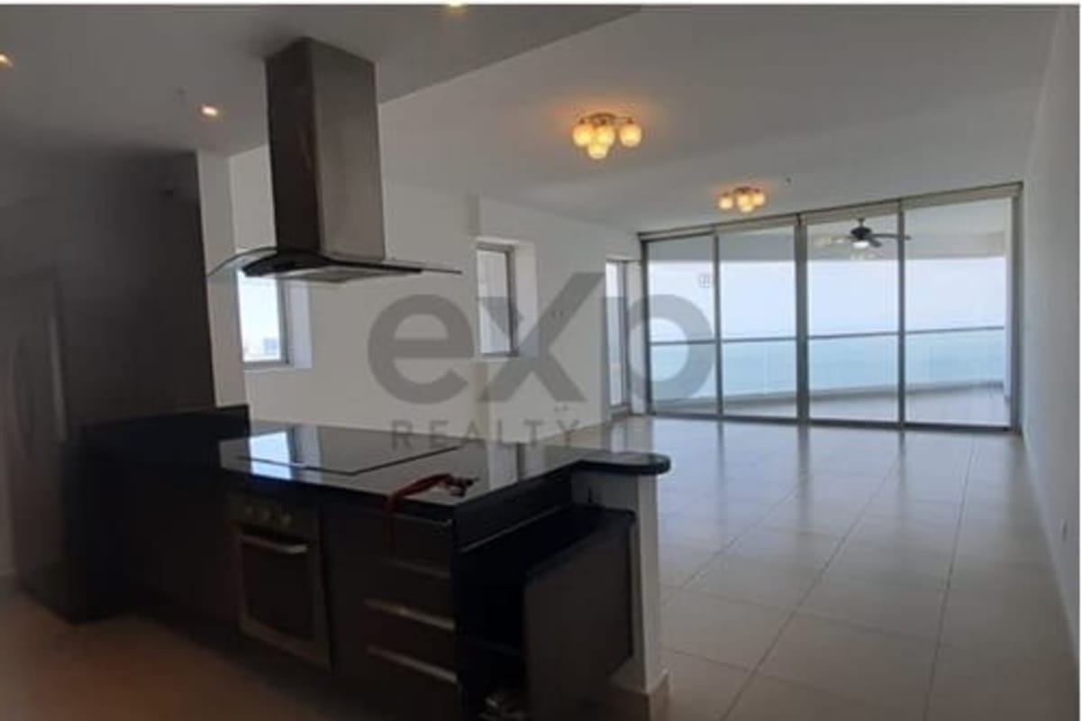 Fully equipped modern kitchen with granite countertop open to living space in PH BICSA Panama