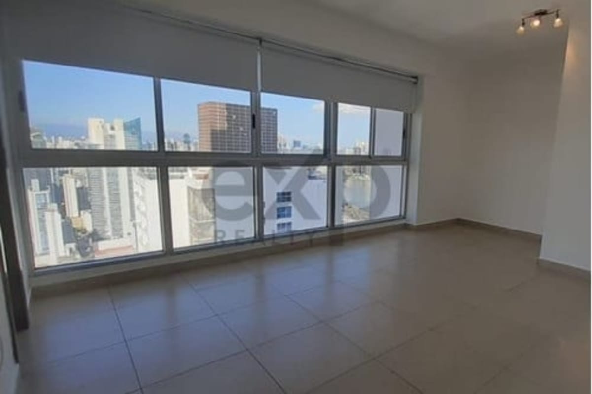Luxury Panama City condo living room with skyline and Pacific Ocean views floor to ceiling glass PH BICSA