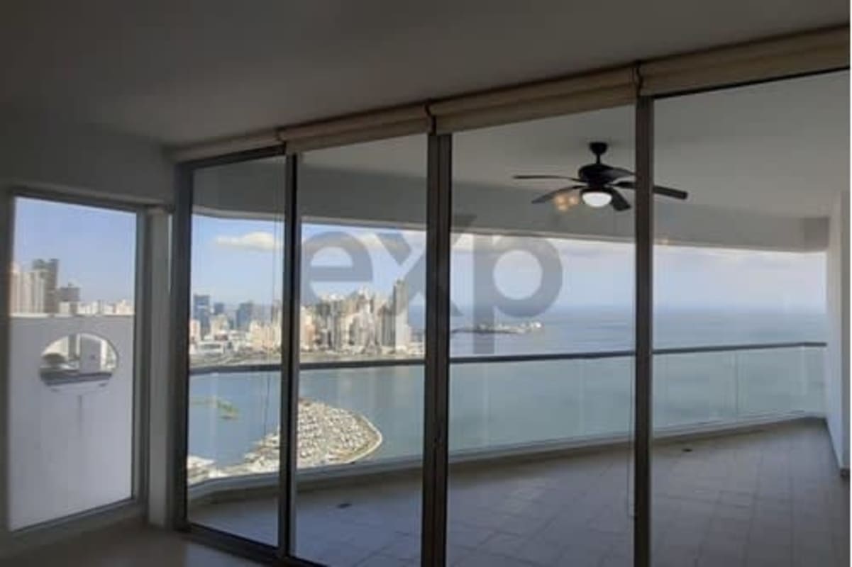 Modern ocean view apartment open plan living area with floor to ceiling windows balcony PH BICSA Panama