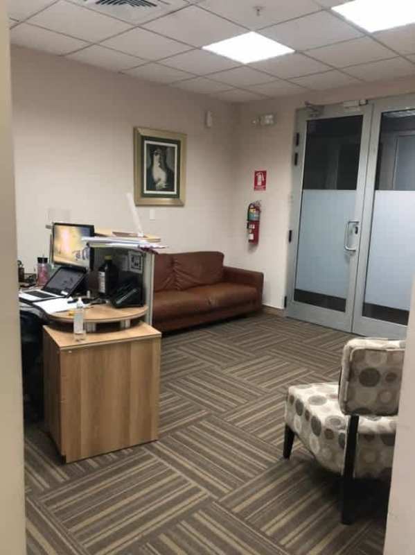 Private office with large floor-to-ceiling windows overlooking business district Office One Tower Panama