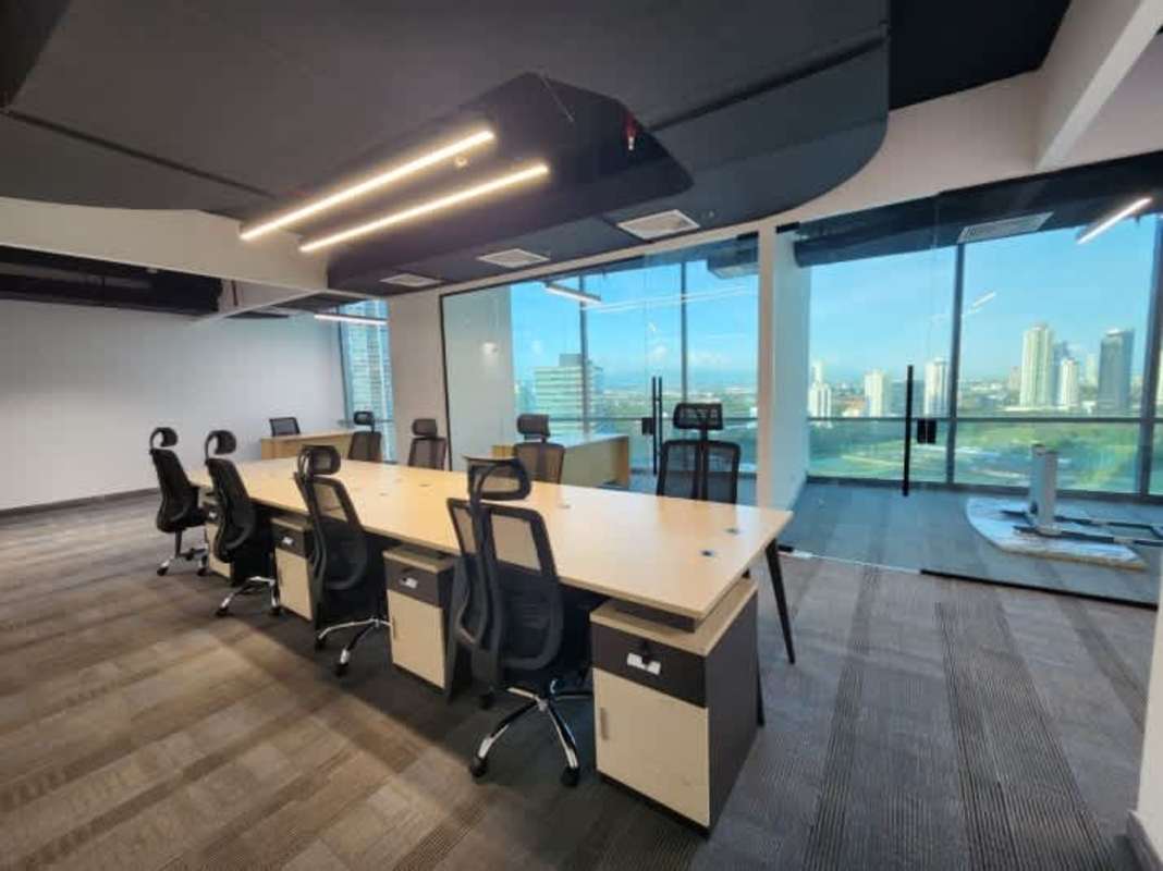 Conference room with large table ergonomic chairs panoramic windows Costa del Este Panama