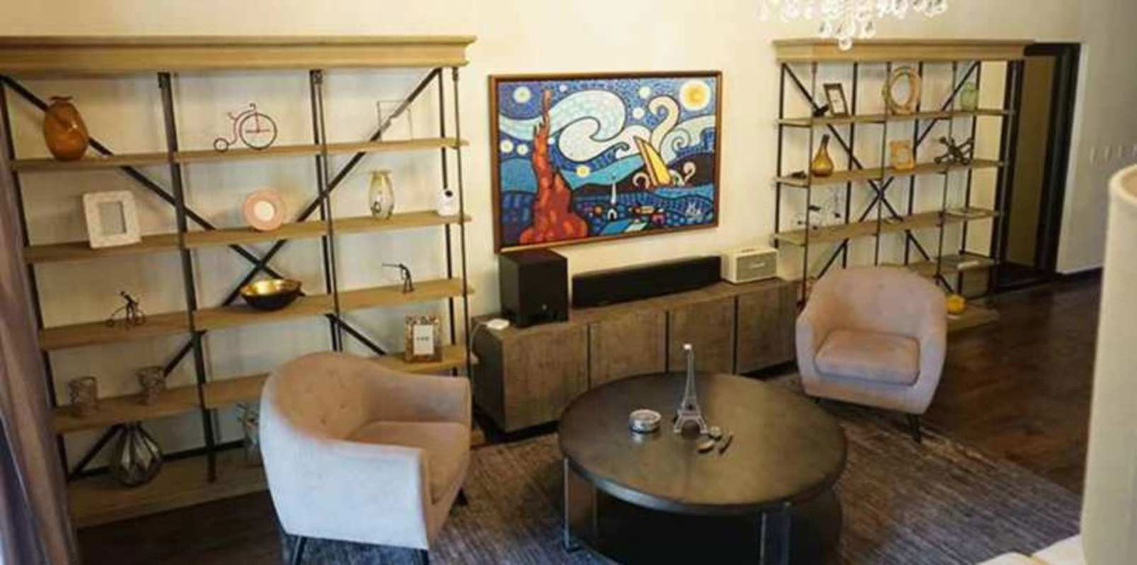 Family/second living room with contemporary art, shelving, chandelier in luxury Clayton villa Panama