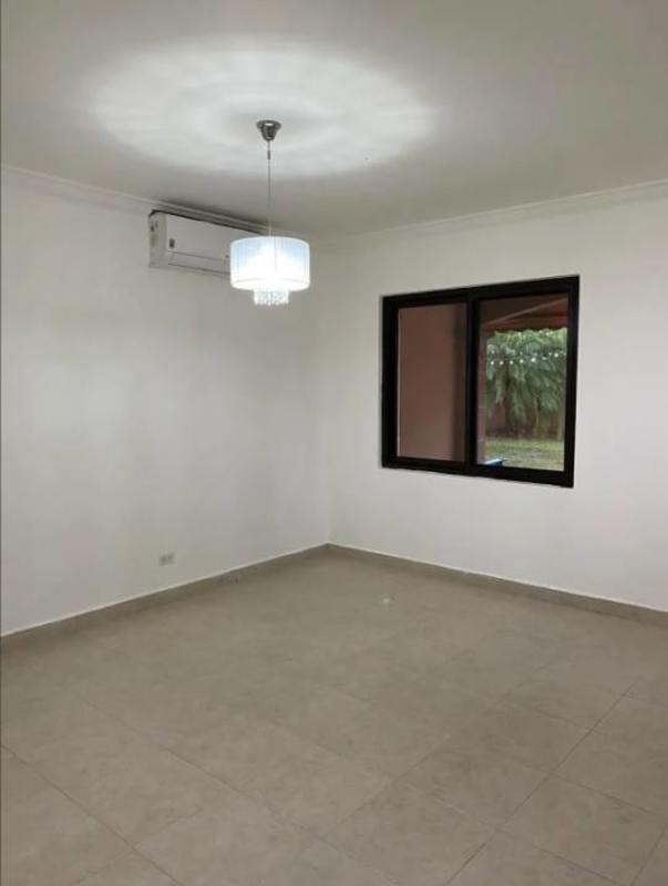 Fully equipped kitchen with granite counters and wood cabinetry in PH Versalles