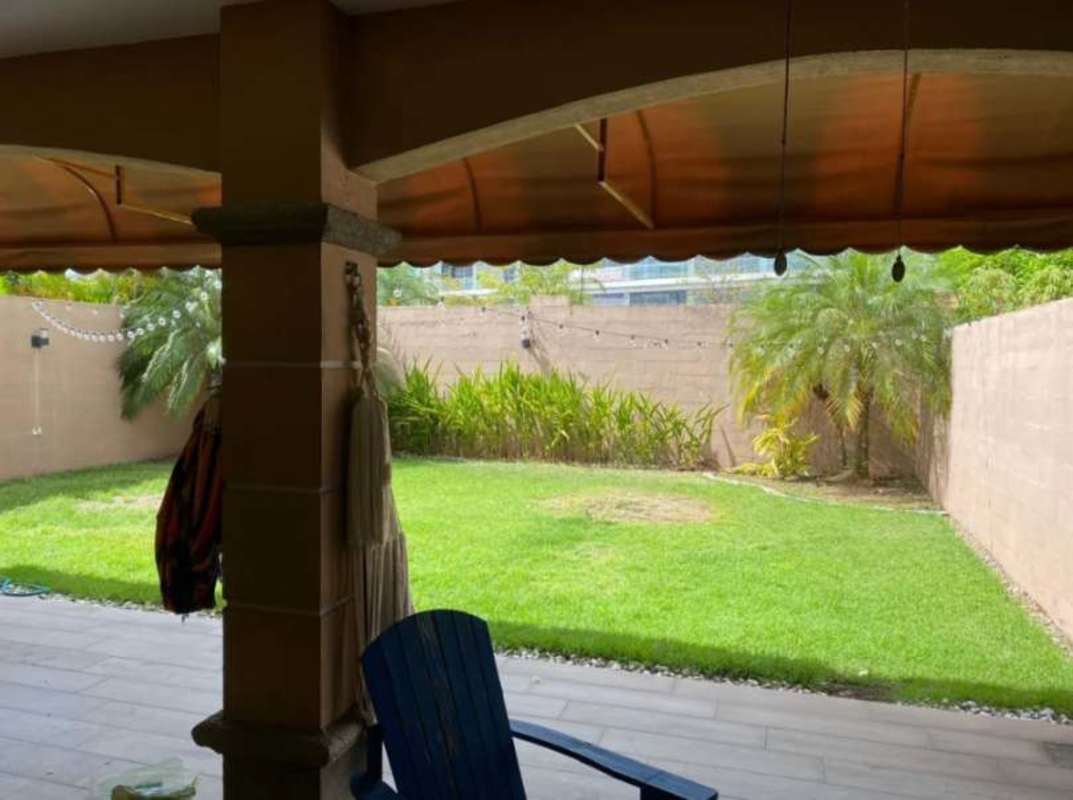 Backyard with covered patio terrace, landscaped garden in PH Versalles Panama