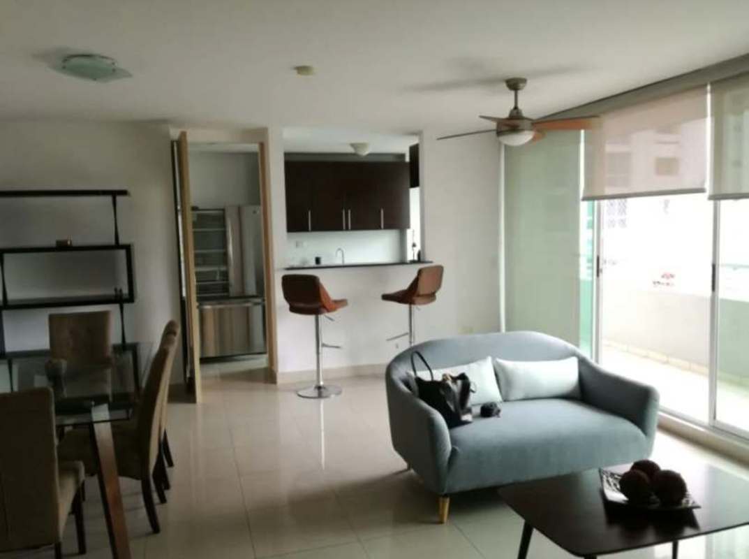 Open kitchen with granite countertops, dark cabinetry and appliances in PH San Francisco Panama City apartment for rent