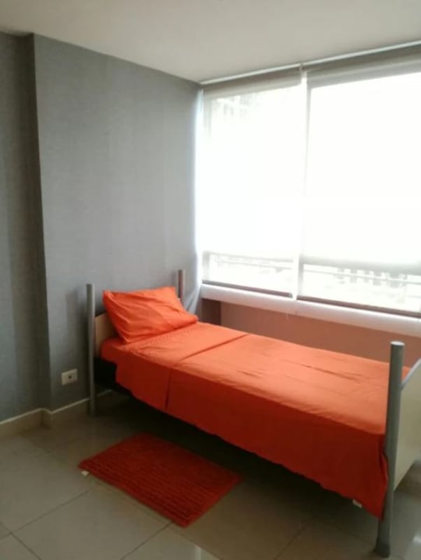 Second bedroom with bed, AC, closet space in furnished PH San Francisco Panama rental