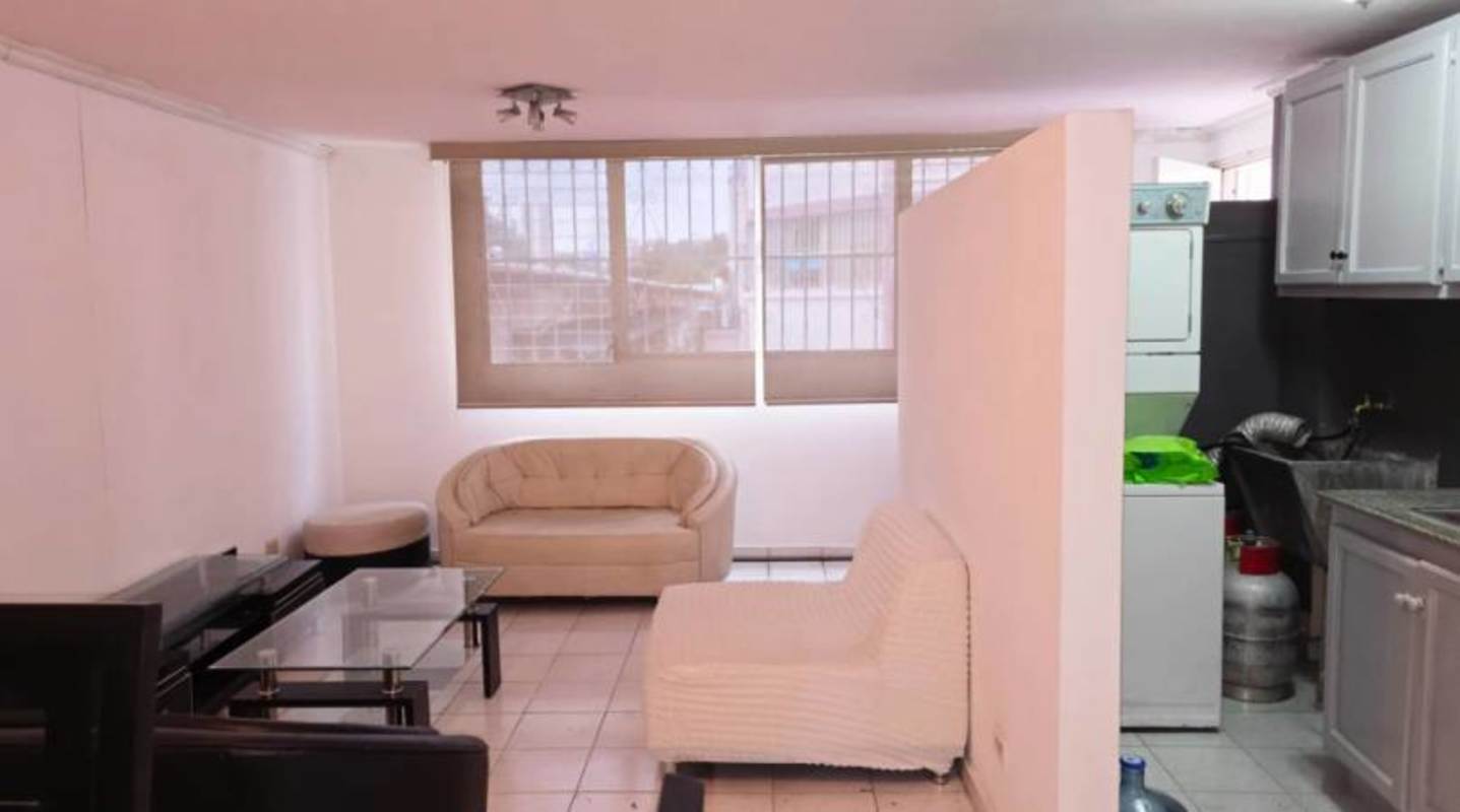 Bedroom with air conditioner, built-in closet, window with louvered panels at PH Parque Lefevre Panama City