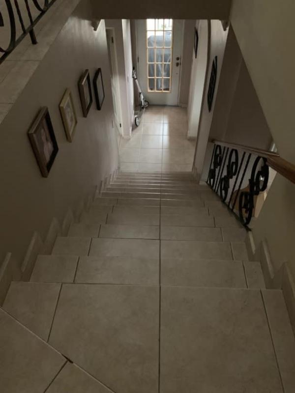 Outdoor fenced basketball court with turf and palm trees Betania Panama