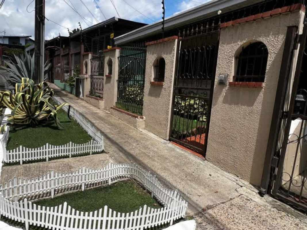 Covered patio gazebo with outdoor seating amidst tropical garden at Villa de Las Fuentes Panama