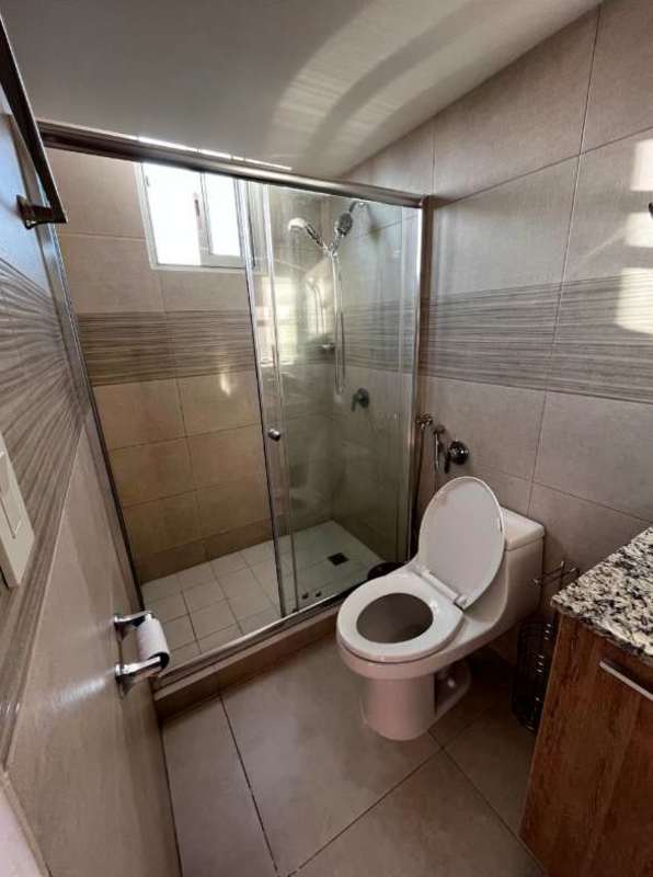 Modern bathroom with walk-in shower, granite countertop and neutral tiles, Condado del Rey Panama apartment