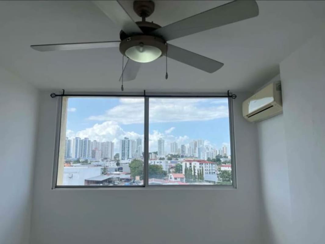 Bedroom with ceiling fan, AC and large window PH Parque Lefevre Panama City