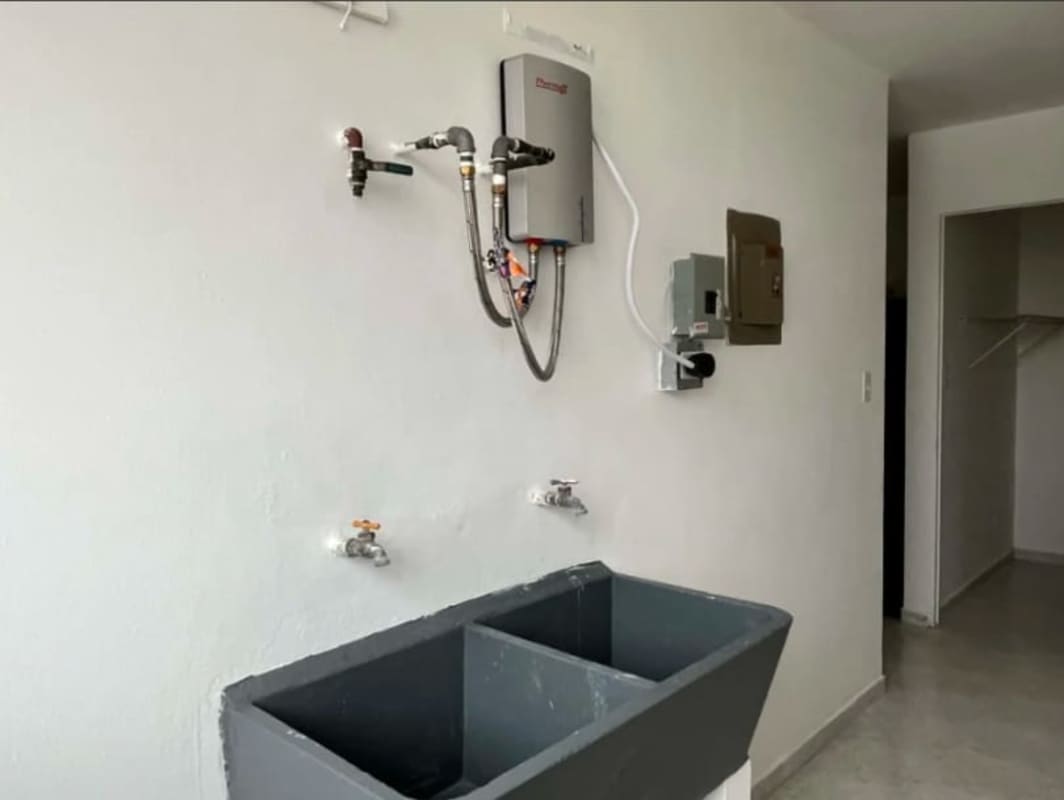 Laundry space with tankless water heater, utility sink PH Parque Lefevre Panama City