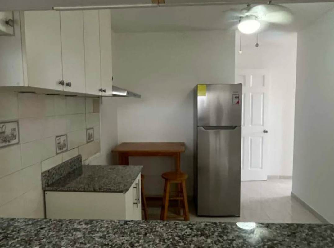 Kitchen with granite countertop, white cabinets, breakfast nook PH Parque Lefevre
