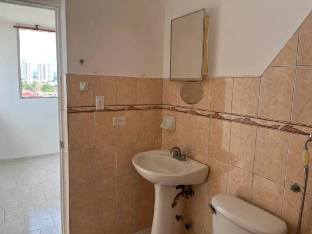 Bathroom with pedestal sink, decorative tiles, mirror in PH Parque Lefevre Panama City