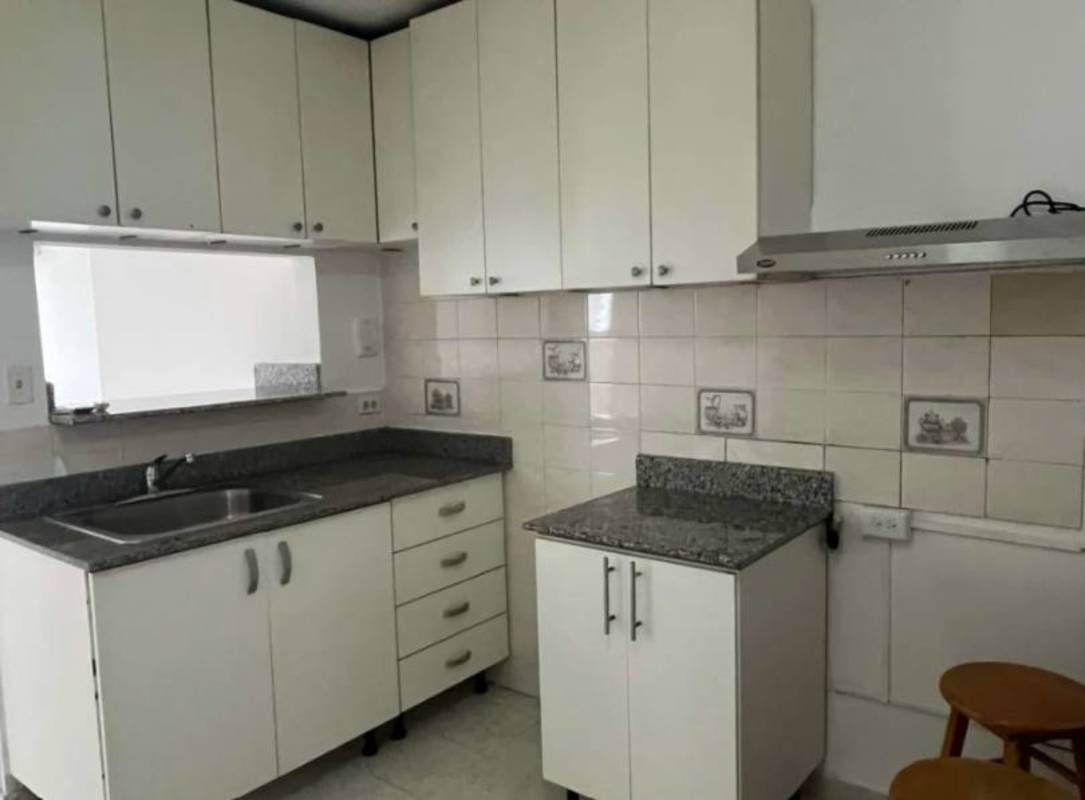 Modern kitchen with granite countertops, white cabinets in PH Parque Lefevre Panama City