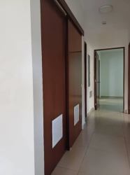 Hallway in River Valley apartment with sliding wooden closet doors and tile flooring