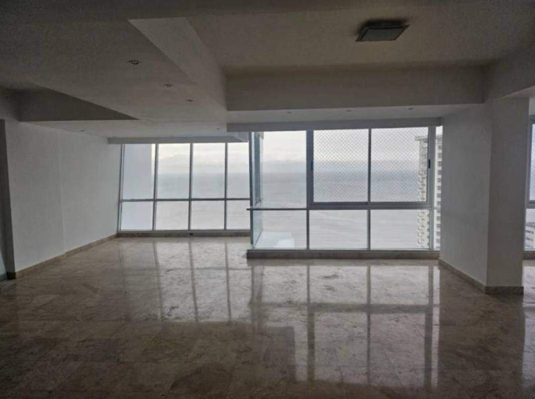 Contemporary marble staircase with glass railing in duplex condo PH Ocean House Costa del Este Panama