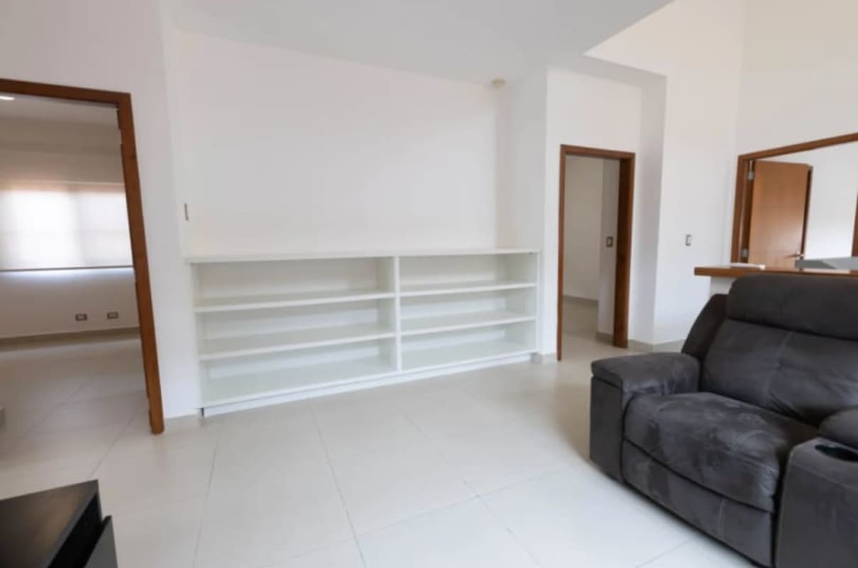 Granite countertop kitchen with wooden cabinets and stainless appliances in Costa Sur home