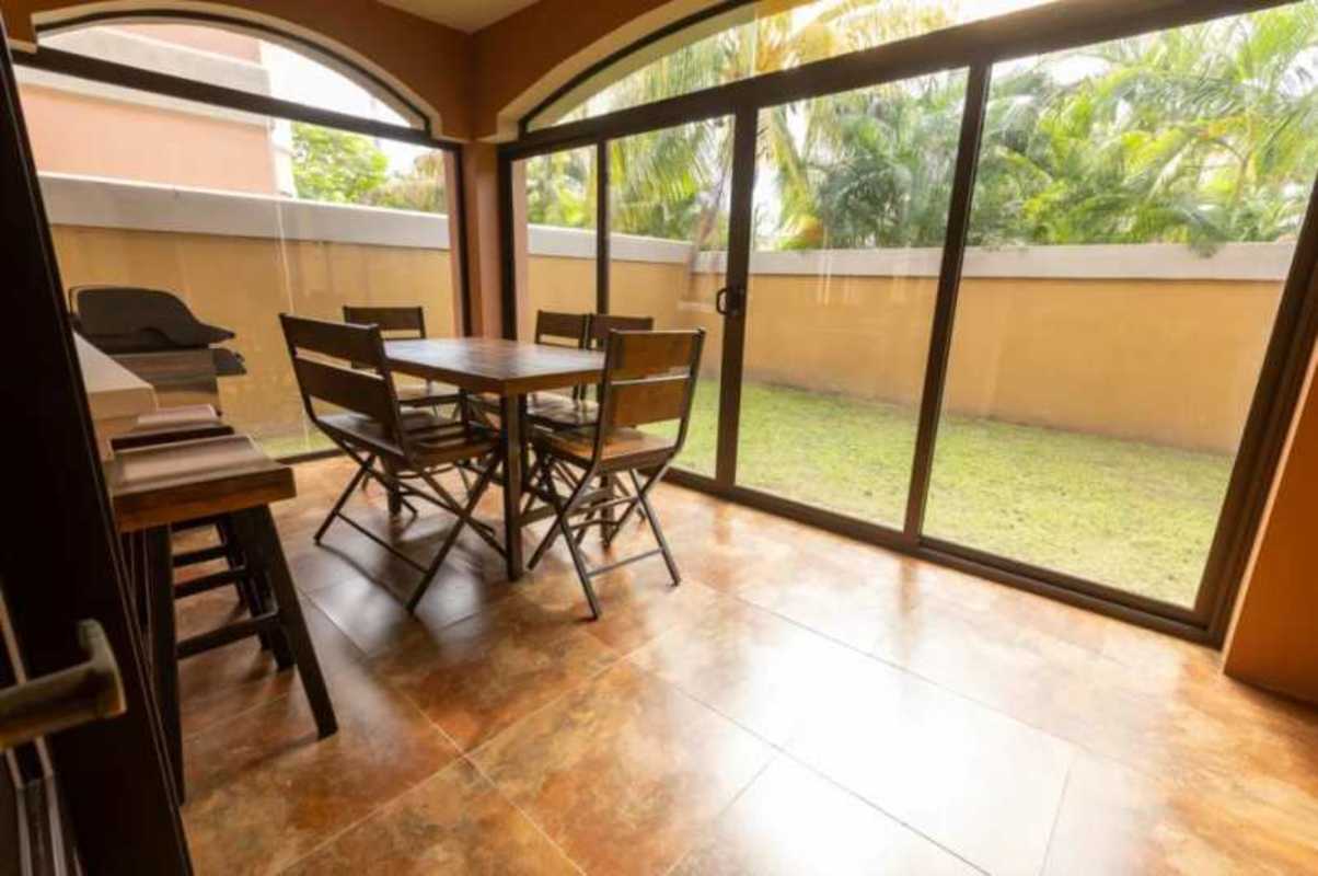 Sunroom dining room with sliding doors to garden Costa Sur home Panama
