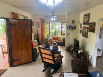 Living room with ceramic tile floor and open plan design in Coronado beach house