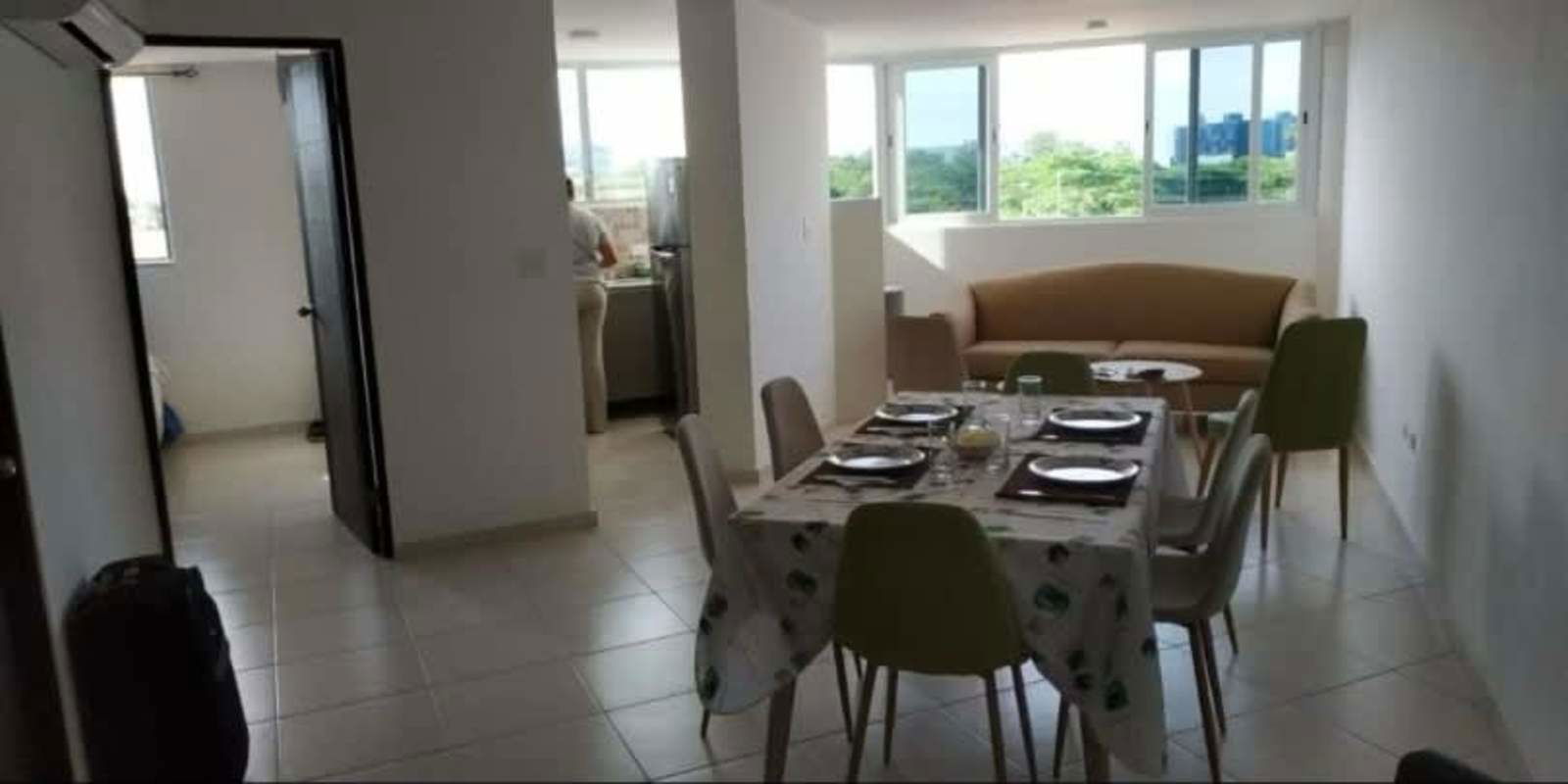 Open bright living dining with large windows in PH Lomas de Santa María Panama City