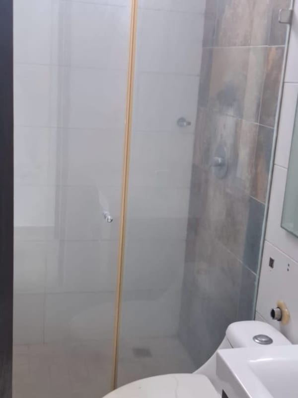 Bathroom with glass shower enclosure, vanity sink in PH Bay Front Panama