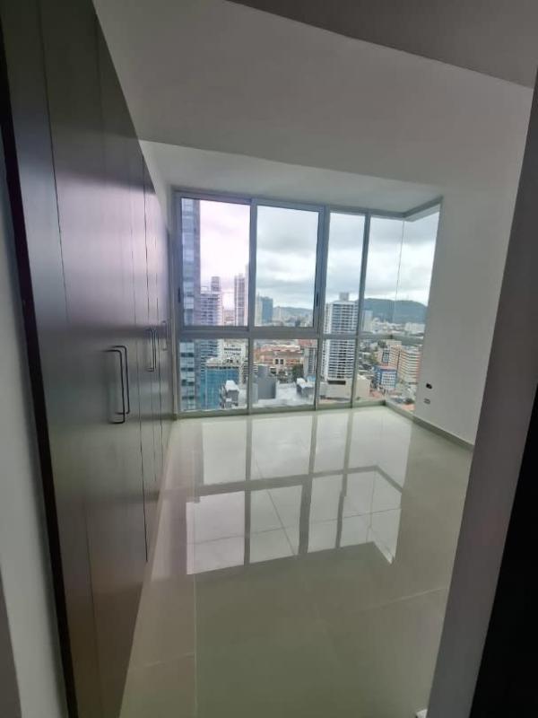 Bedroom with closet and large window, natural light in PH Bay Front Bella Vista Panama City