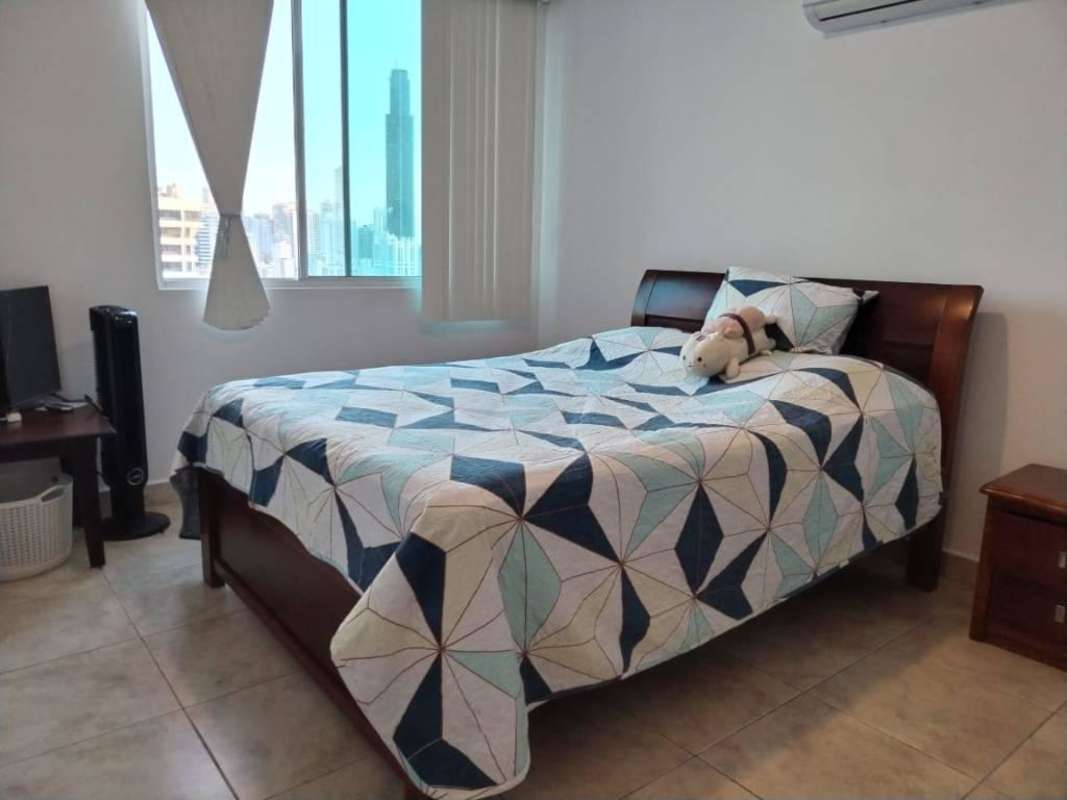Bedroom with city skyline view, AC unit and tiled floor PH Vista Tower Panama