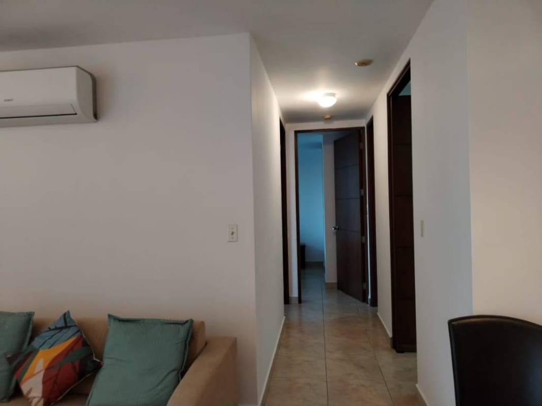 Interior hallway and living space with AC unit, tiled flooring, and sofa PH Vista Tower Panama